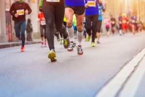 Unrecognizable young runners at the city race